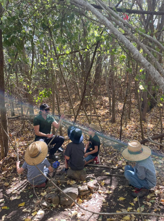 Forest school educator leading a group in the bush
